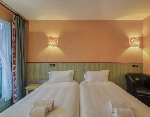 lit chambre double ou twin  Hôtel Florimont